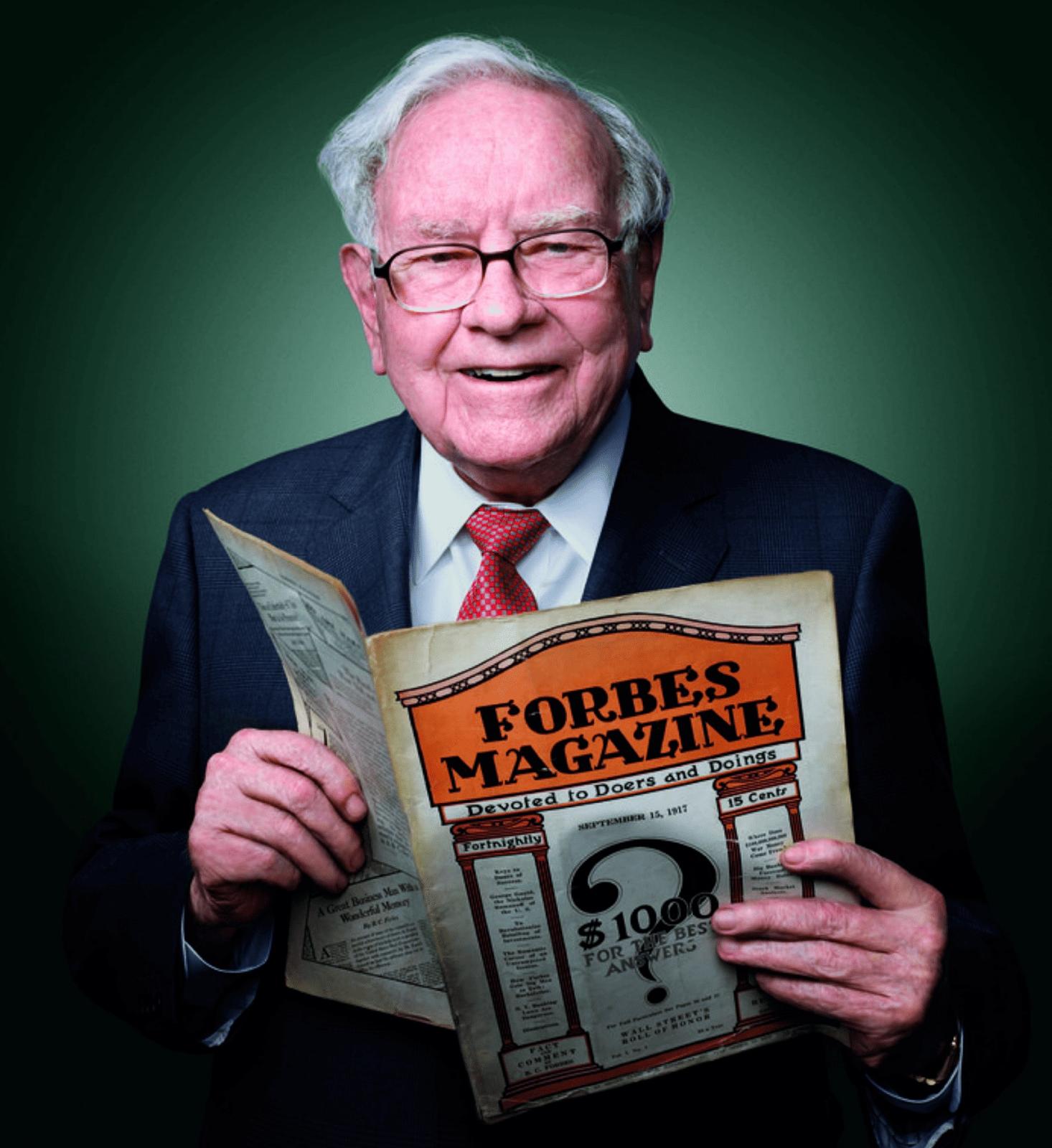 A man holding Forbes Magazine