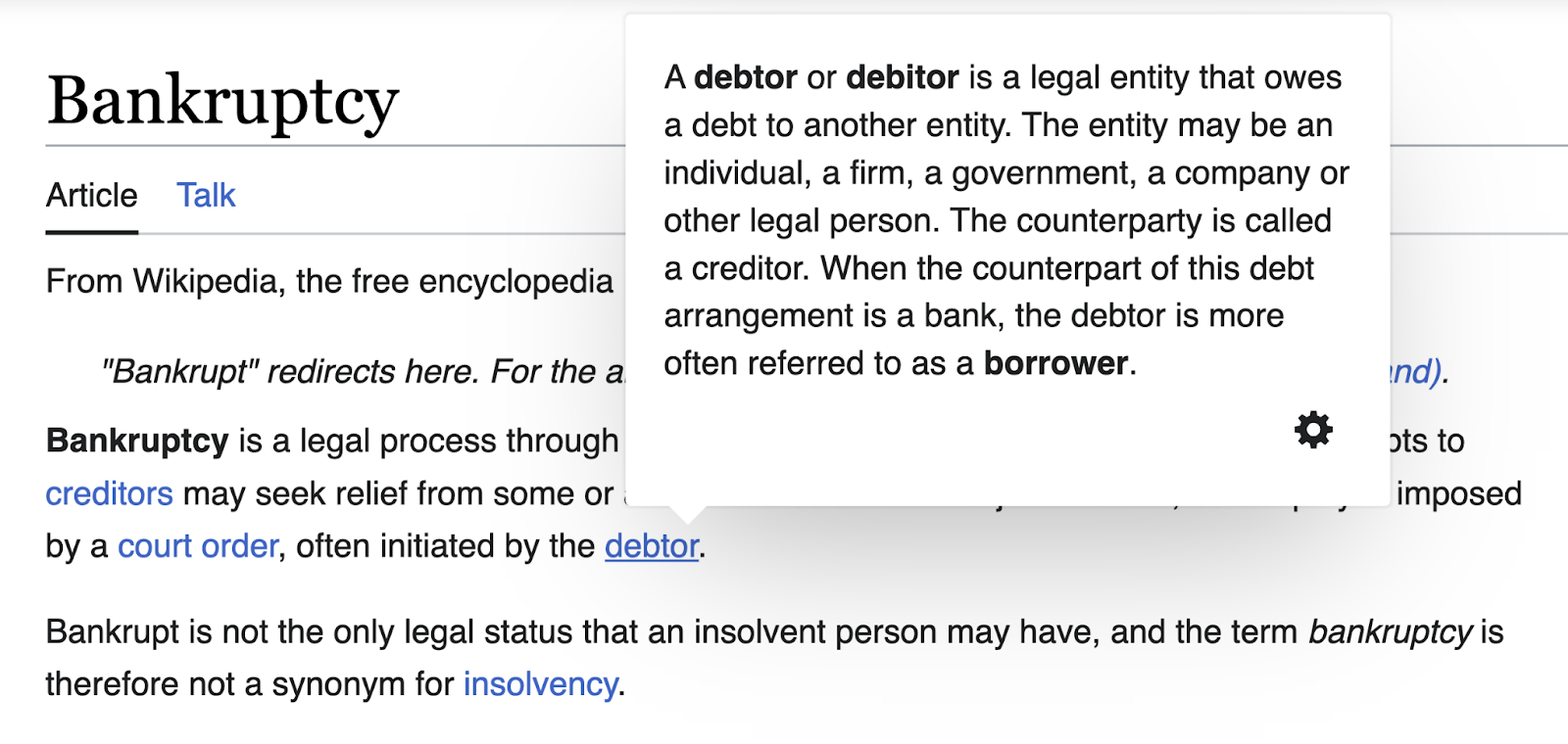 A definition tooltip opened for "debtor" on Wikipedia