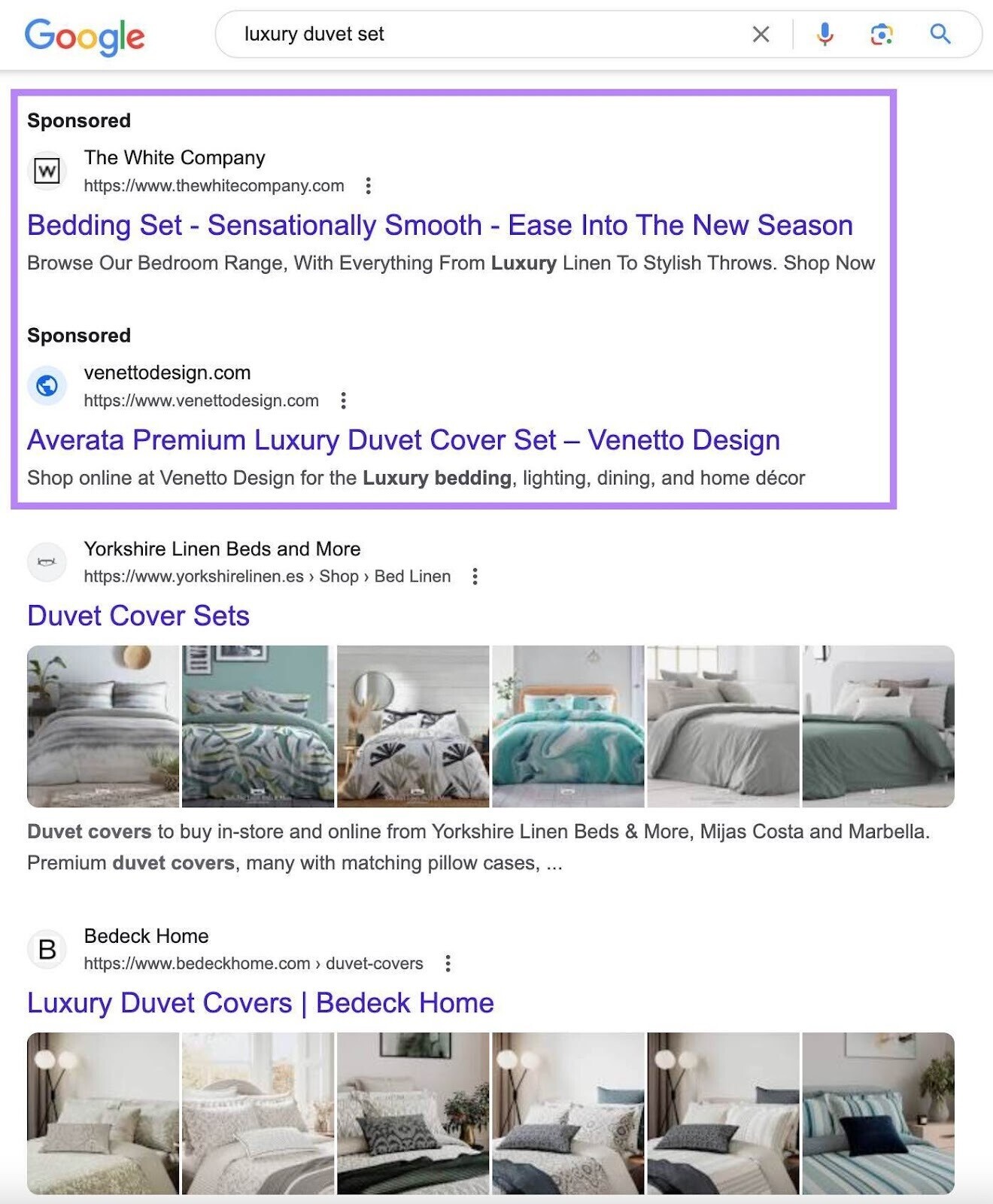 anuncios de búsqueda pagados en la parte superior de una página de resultados de Google para "juego de edredones de lujo"