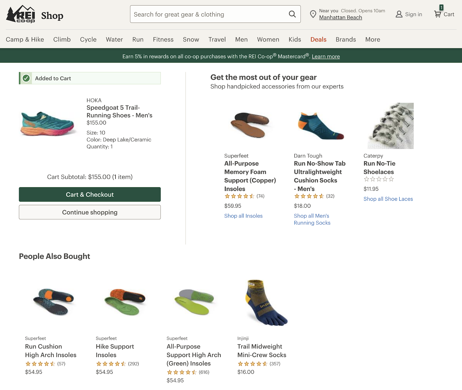 rei shop for a shoe added to cart with accompanying products