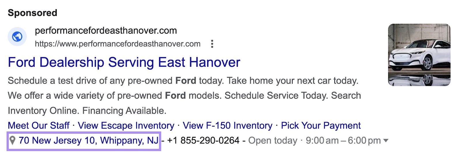 A location extension under Ford dealership in New Jersey search ad