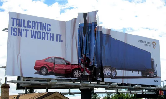 A billboard ad being physically crumbled to mimic an accident between a car and a truck caused by tailgating.