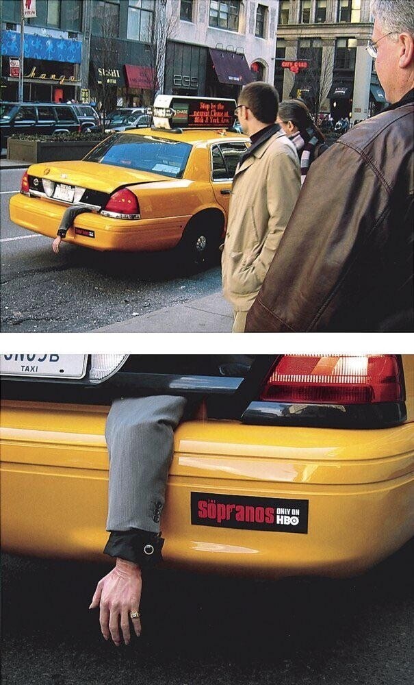 A taxi with a fake arm hanging out of the trunk and an ad for "The Sopranos"