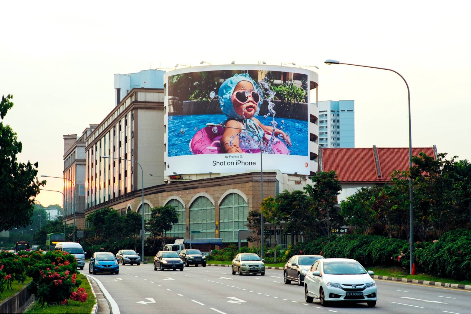 Apple’s billboard with a baby in the pool picture and #ShotOniPhone hashtag