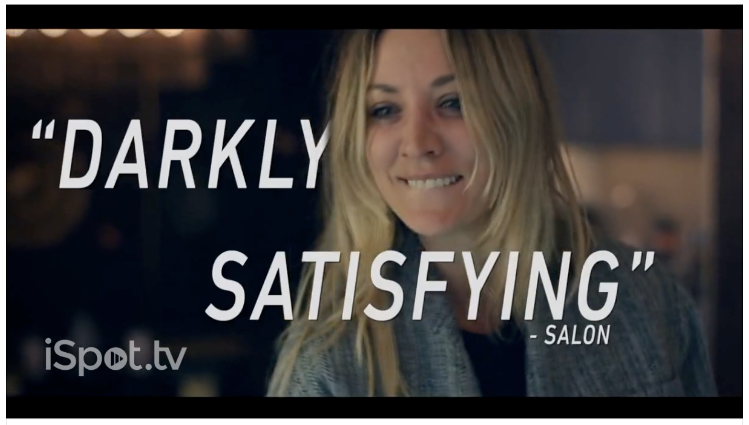 A screenshot of HBO’s trailer for their show The Flight Attendant depicts actress (and show star) Kaley Cuoco smiling. The words “Darkly satisfying - Salon” are wrapped around her. 