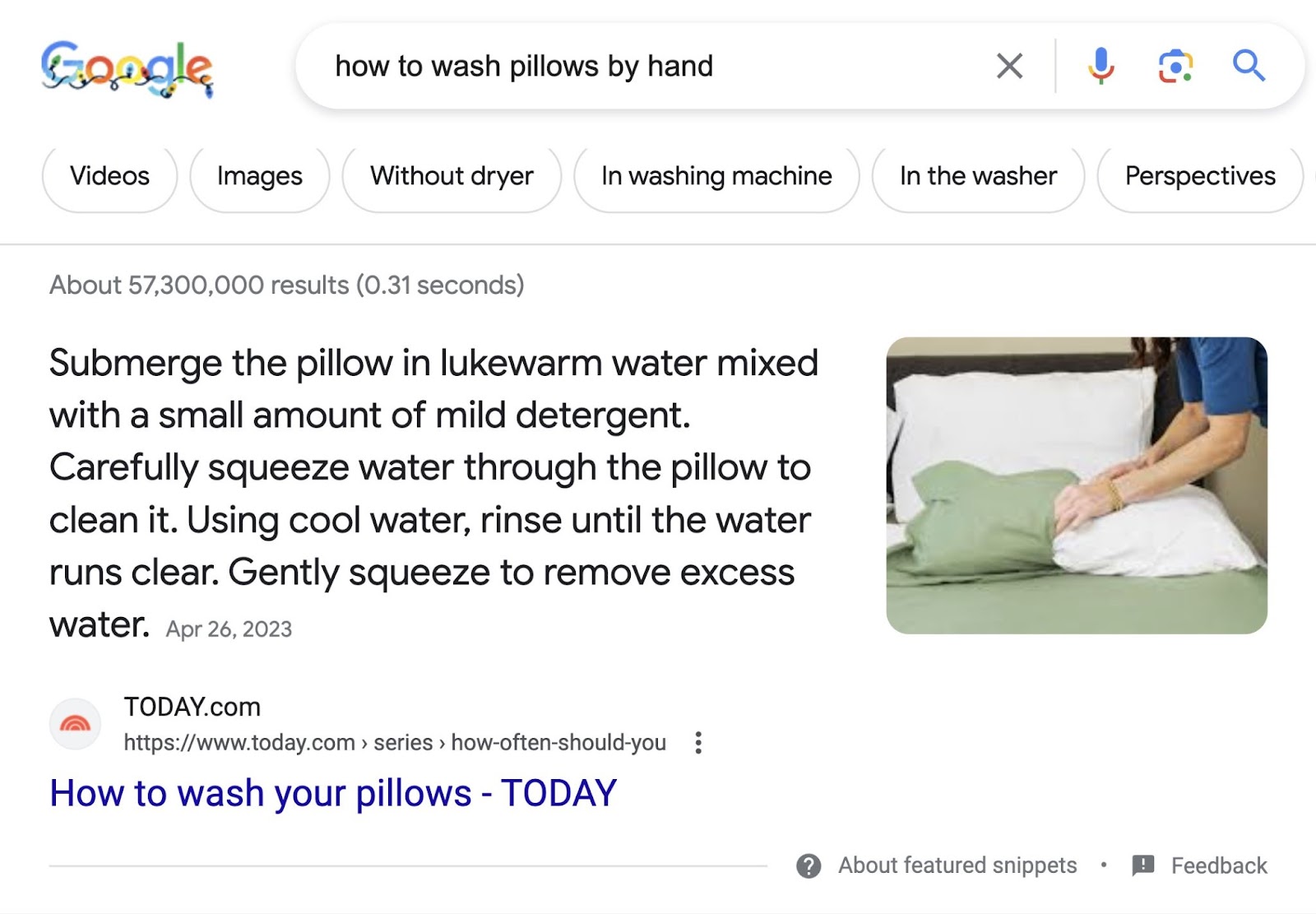 A featured snippet for "how to wash pillows by hand" query