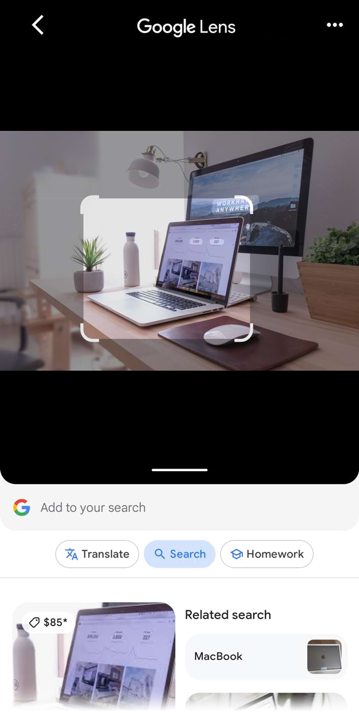 An image of a work desk with laptop uploaded to the Google Lens, showing results for laptops below