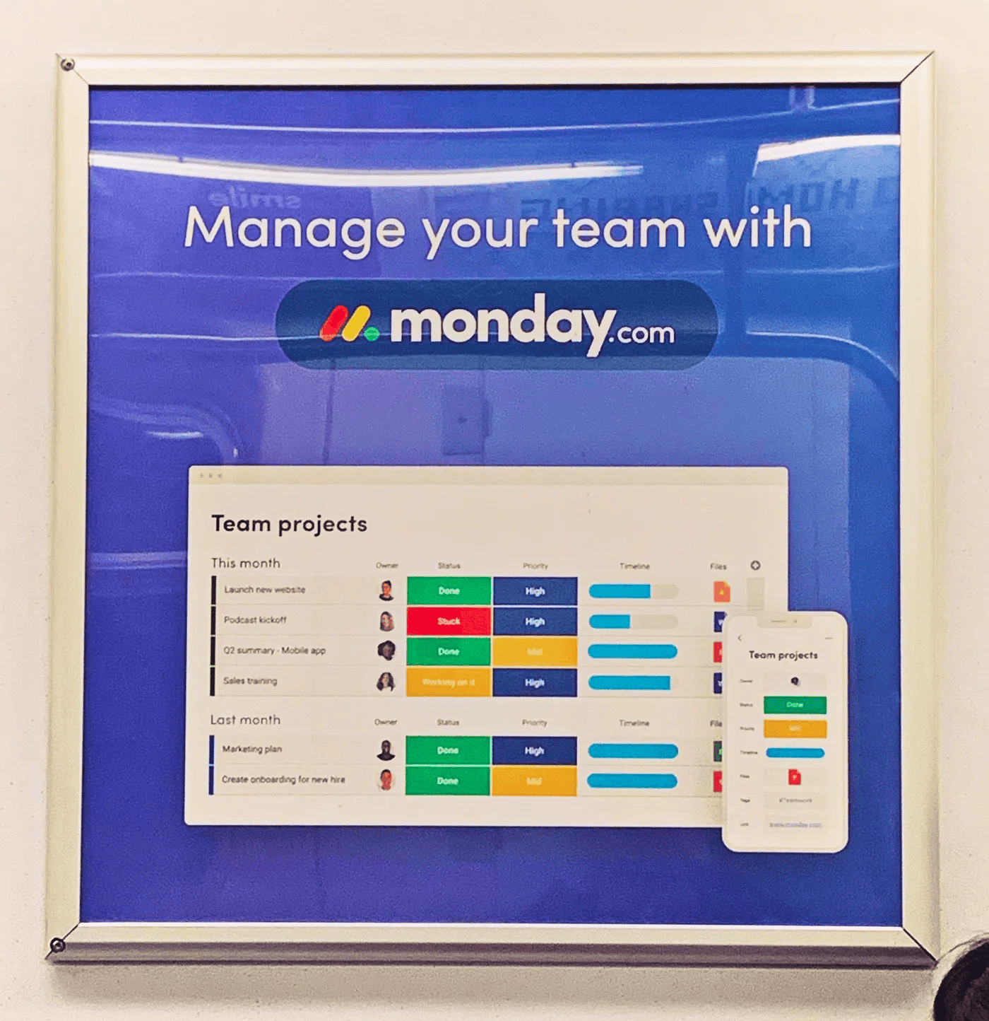 "Manage your team with monday.com" ad on a subway