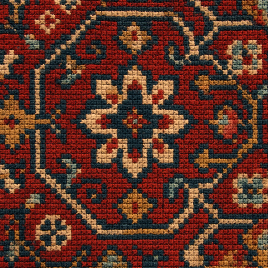 Close-up of a traditional rug's intricate pattern