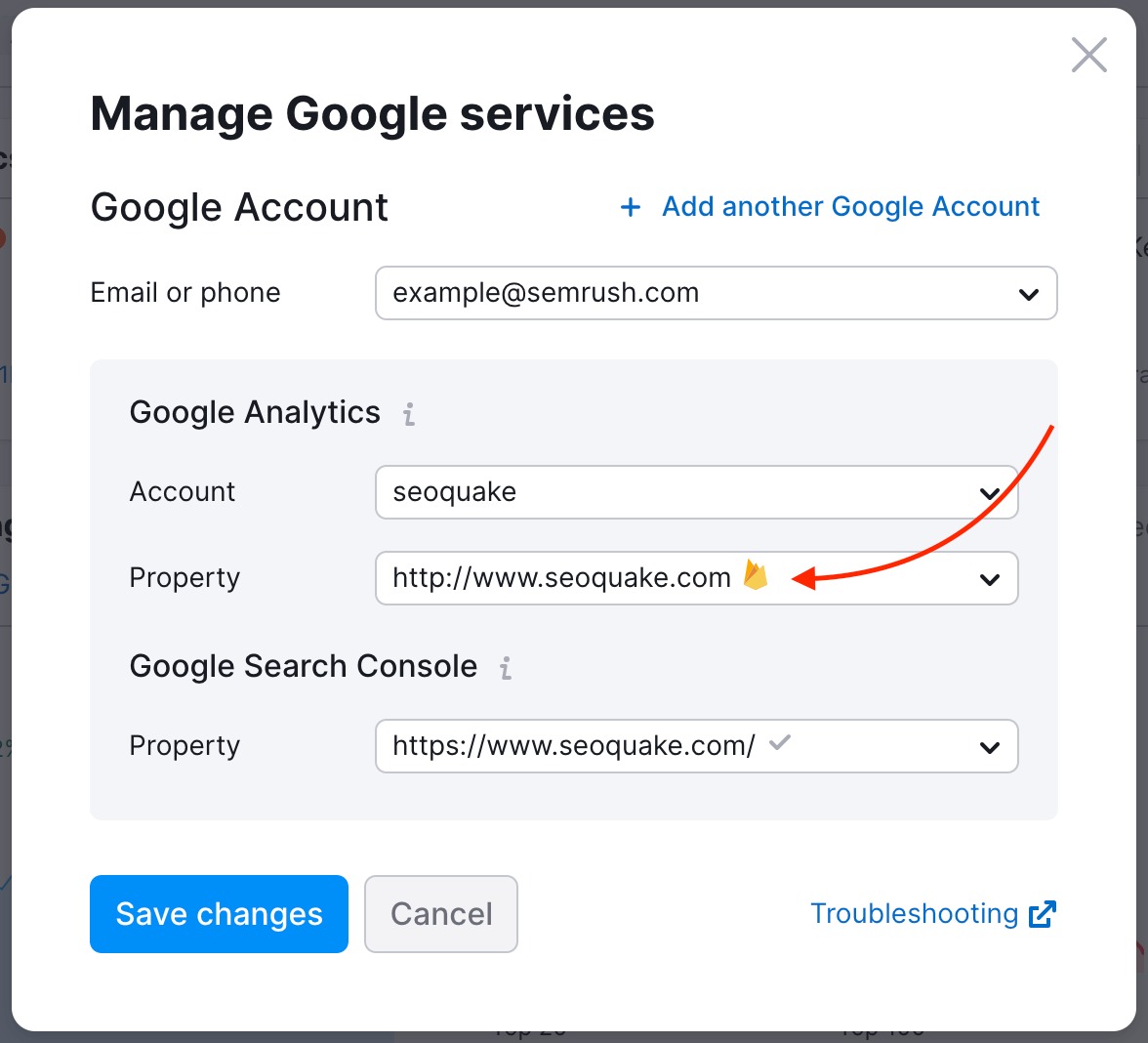 Google Analytics connection wizard with a red arrow pointing to the Folder icon next to the GA4 property. 