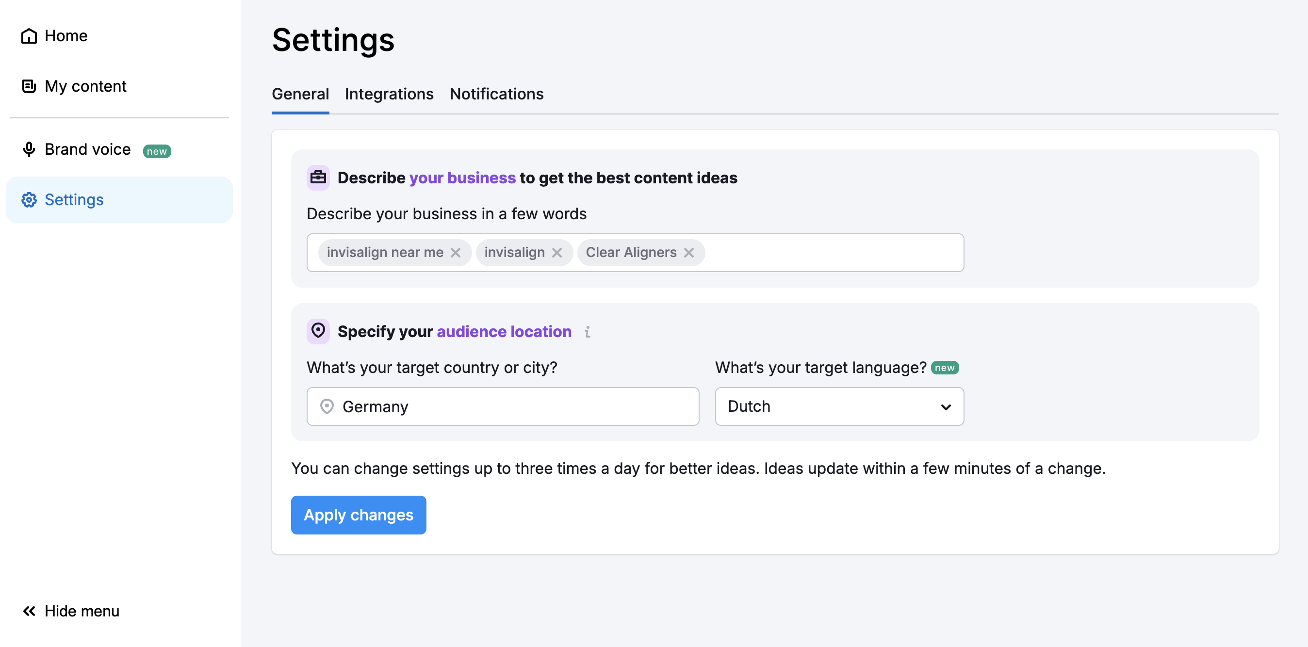 List of settings in the ContentShake AI app were you can describe your business in a few words and specify your audience location and language.